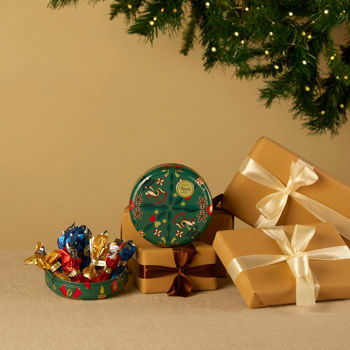 Round Christmas Tin with Comet chocolates 3.03 oz