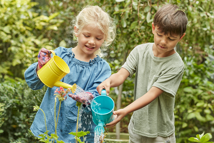 kids watering plants