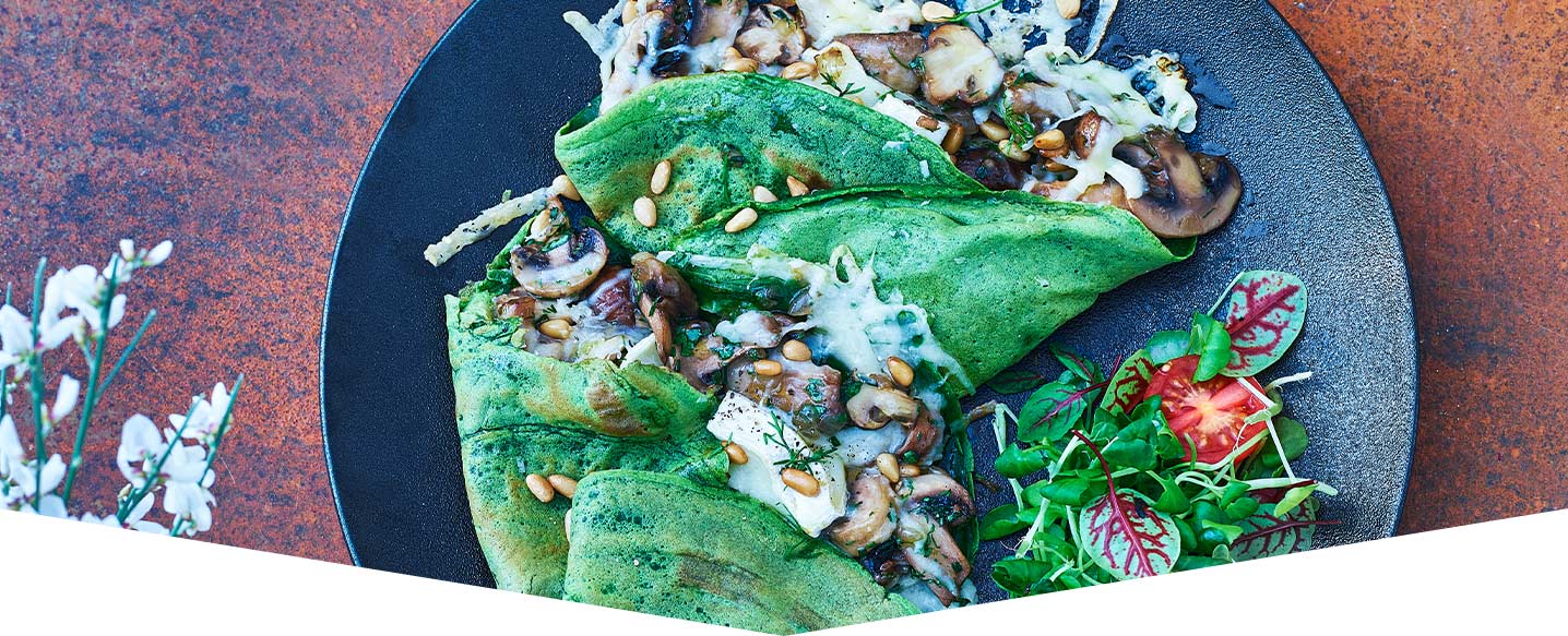 Spinach Crêpes Filled with Goats Cheese and Garlic Mushrooms 