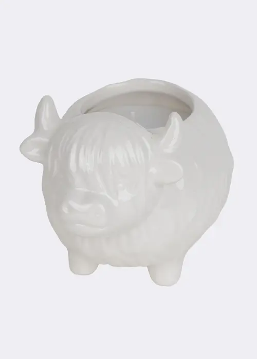A photo of Birch & Heather Ceramic Highland Cow Candle