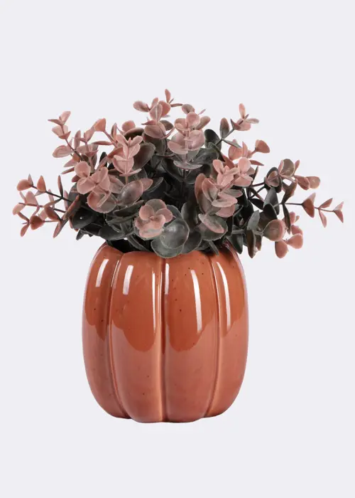 A photo of Faux Grass In Ceramic Pumpkin Pot