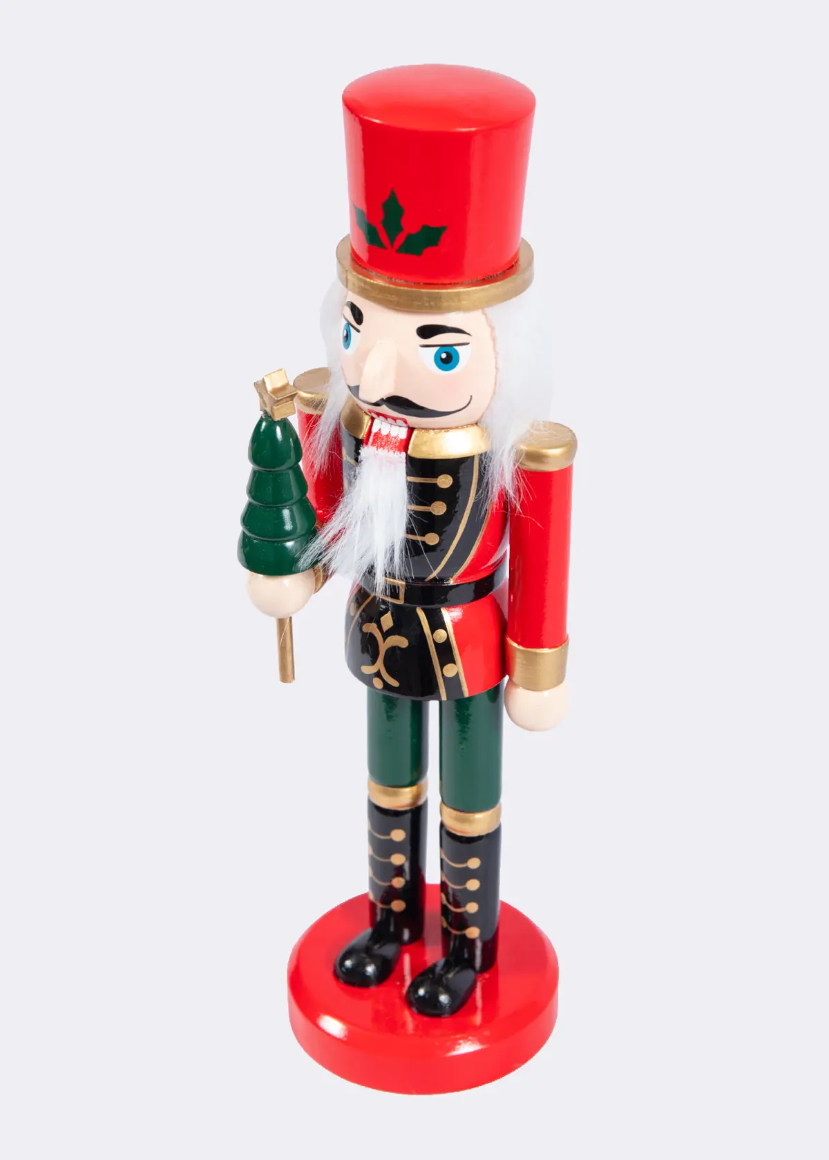 A photo of Red & Green Wooden Nutcracker Holding Christmas Tree 25cm