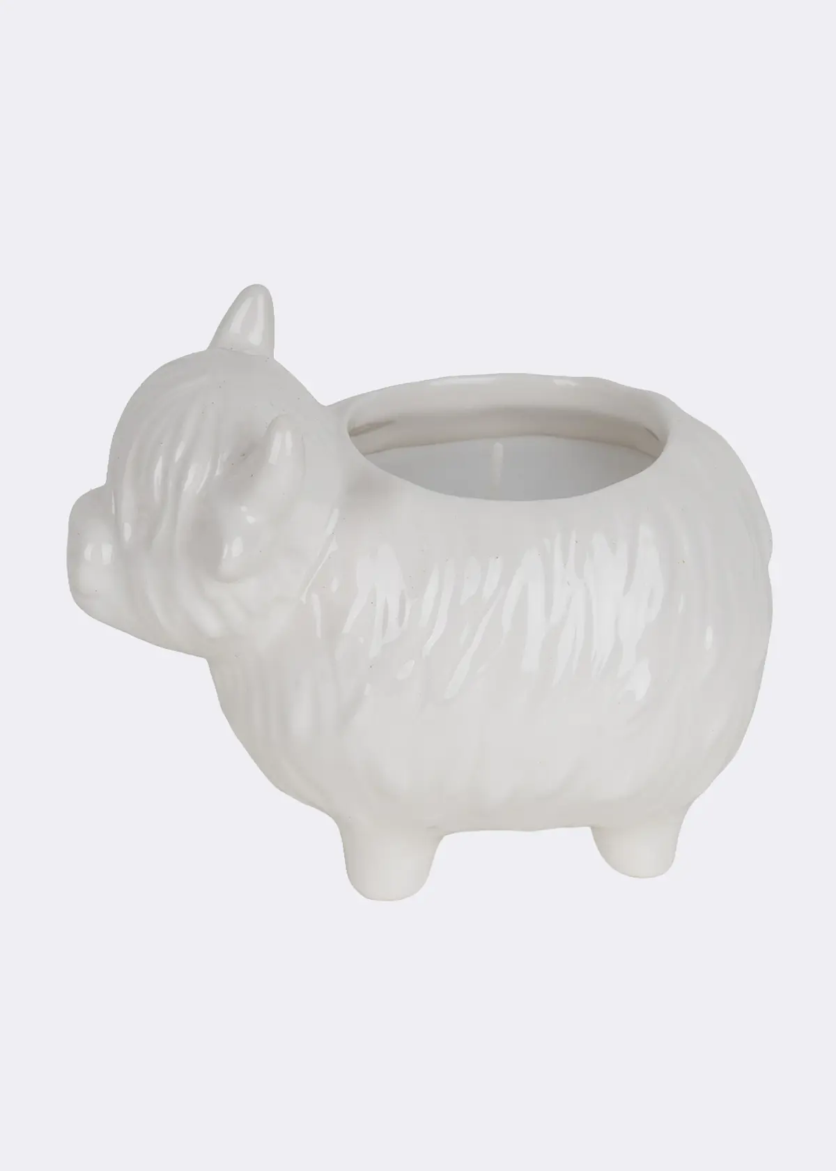 A photo of Birch & Heather Ceramic Highland Cow Candle