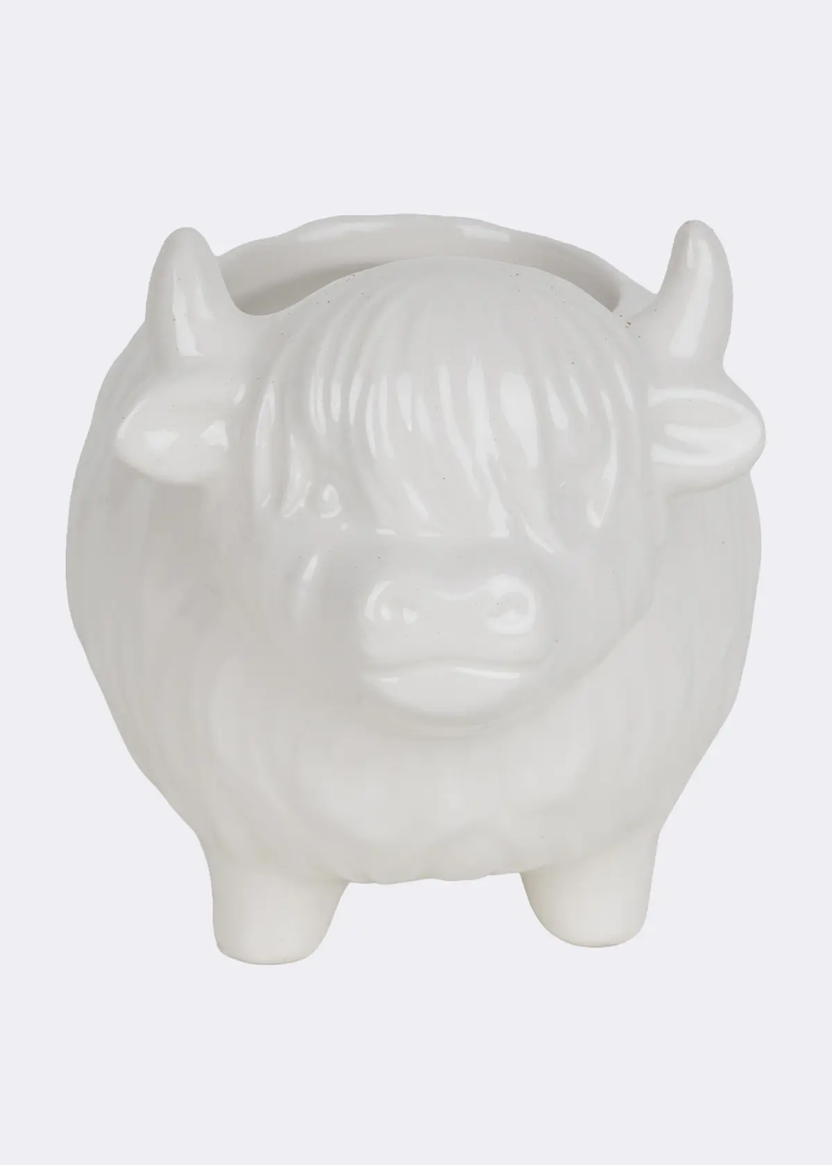 A photo of Birch & Heather Ceramic Highland Cow Candle