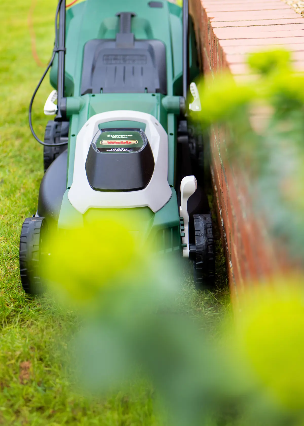 A photo of Webb Supreme 40cm (16") Electric Rotary Lawnmower with Rear