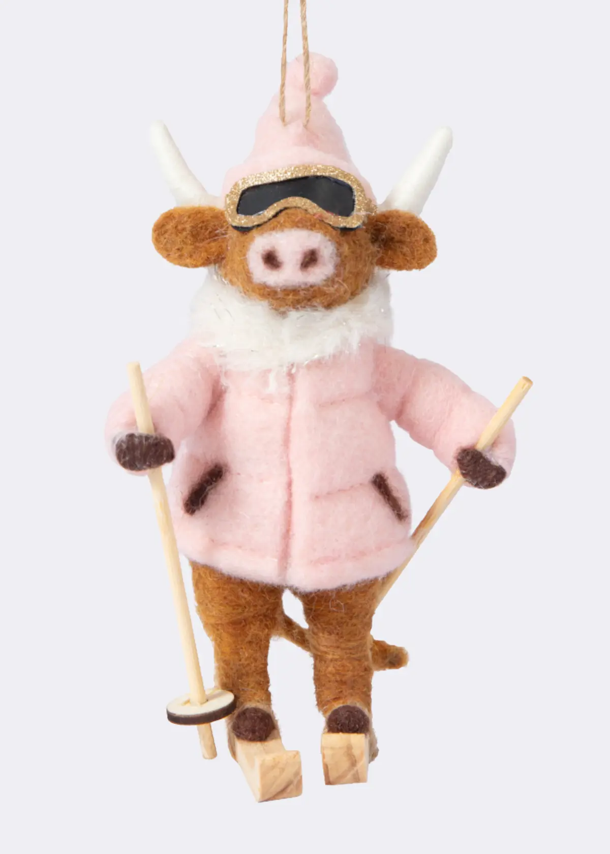 A photo of Needle Felt Skiing Cow Hanging Decoration 11.5cm