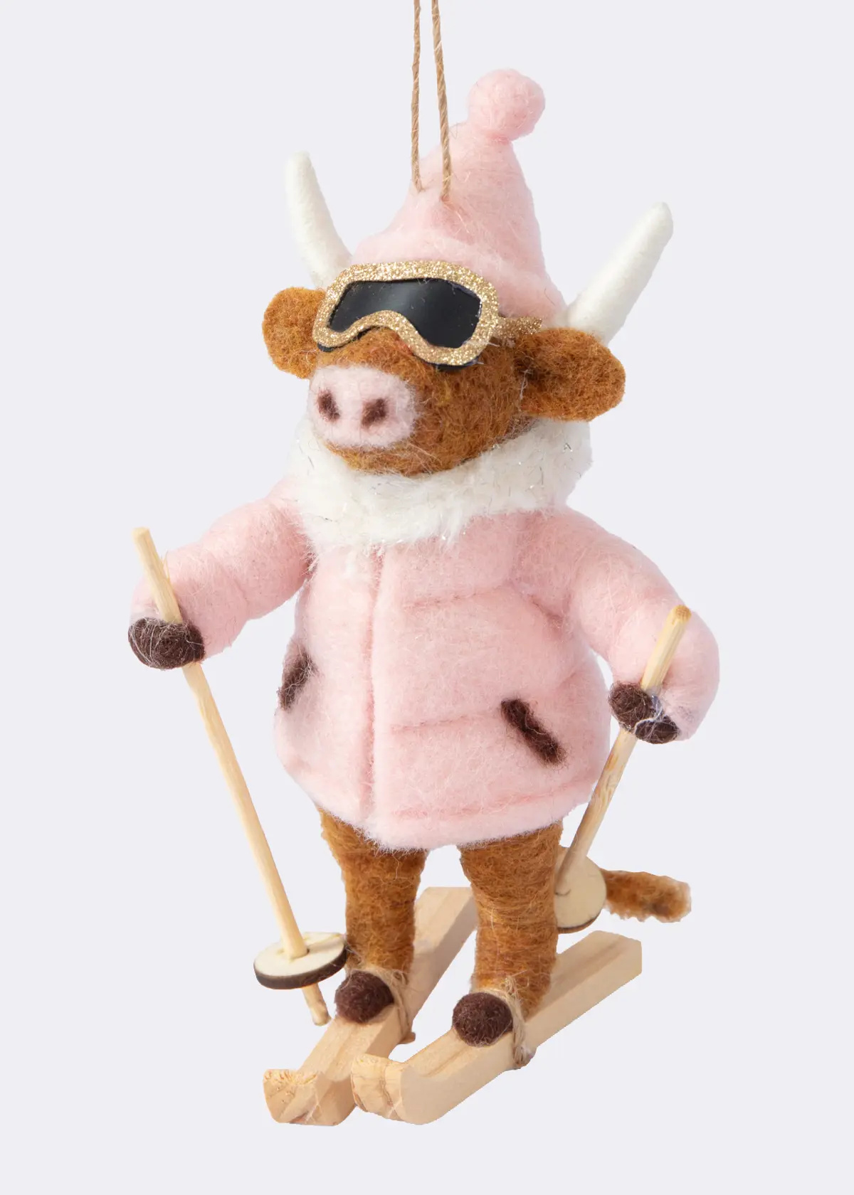 A photo of Needle Felt Skiing Cow Hanging Decoration 11.5cm