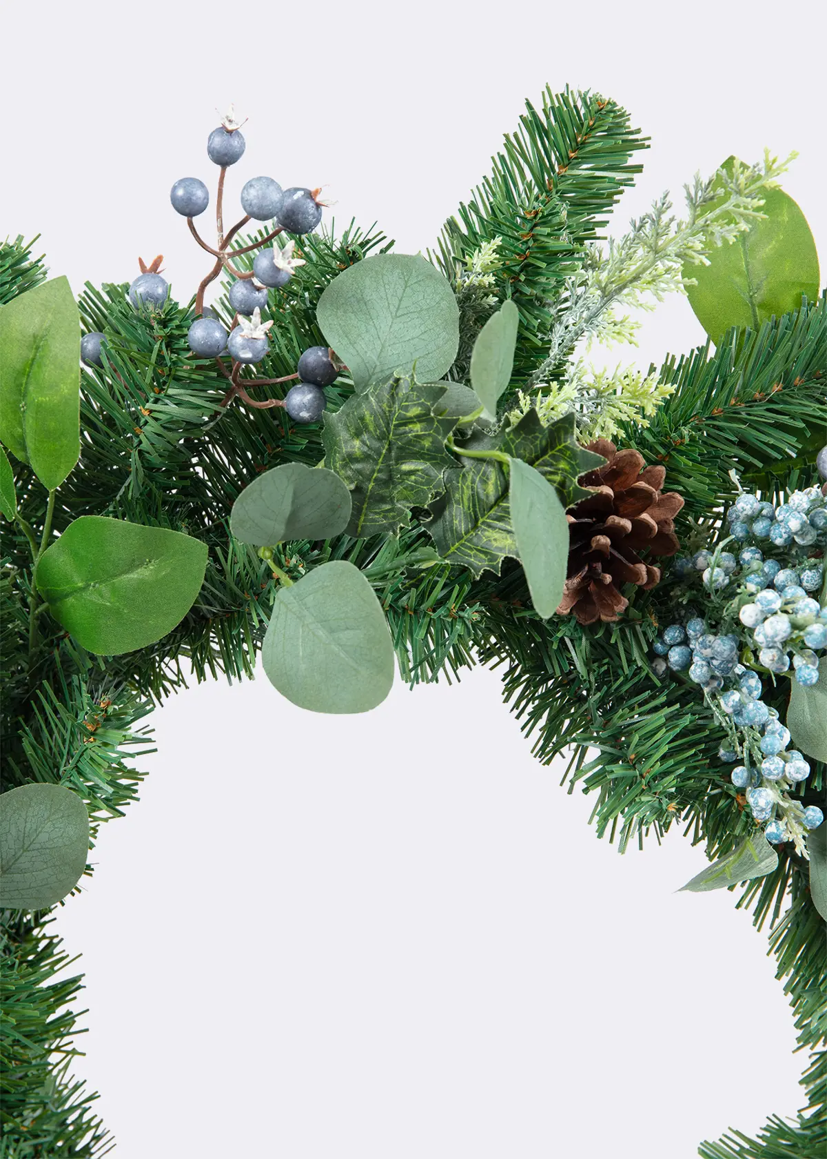 A photo of Artificial Wreath With Blue Berries & Velvet Bow 60cm