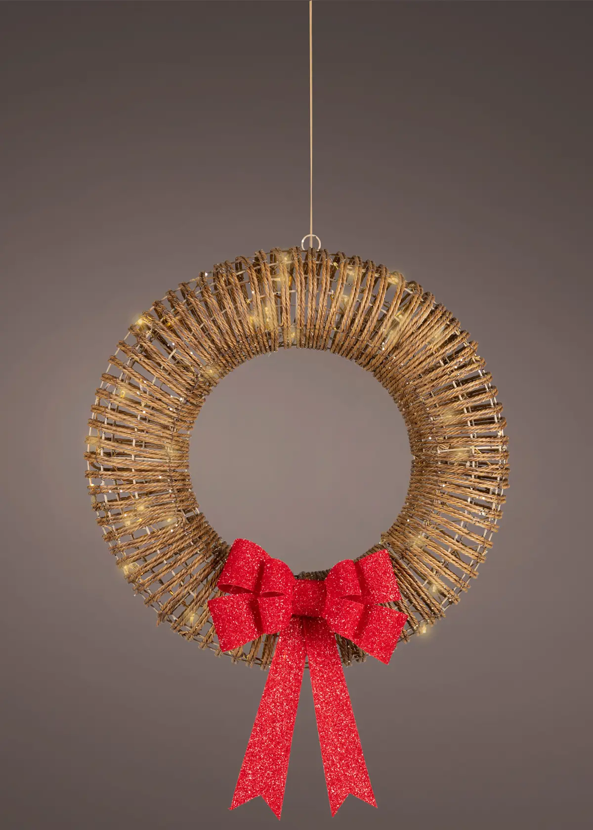 A photo of Gold LED Wicker Wreath With Red Bow 58cm Brown