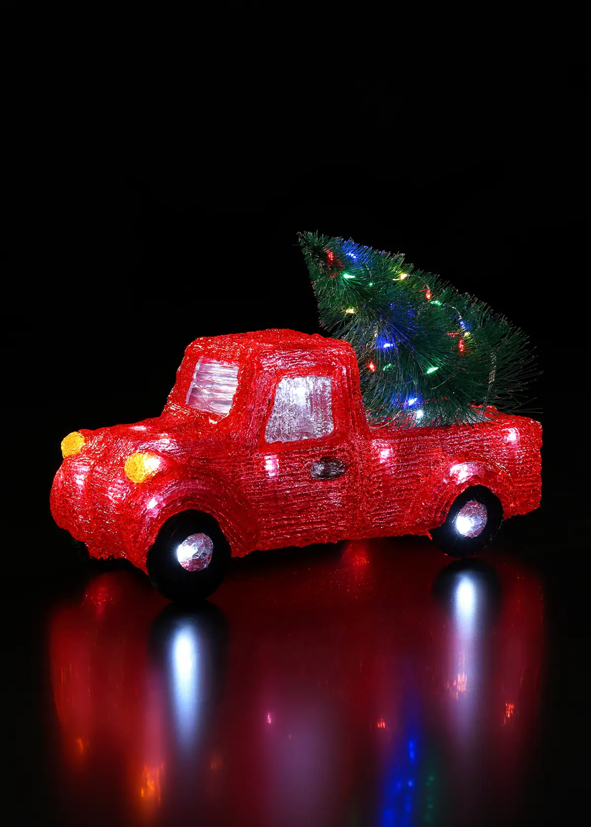 A photo of Acrylic Red Truck With Tree
