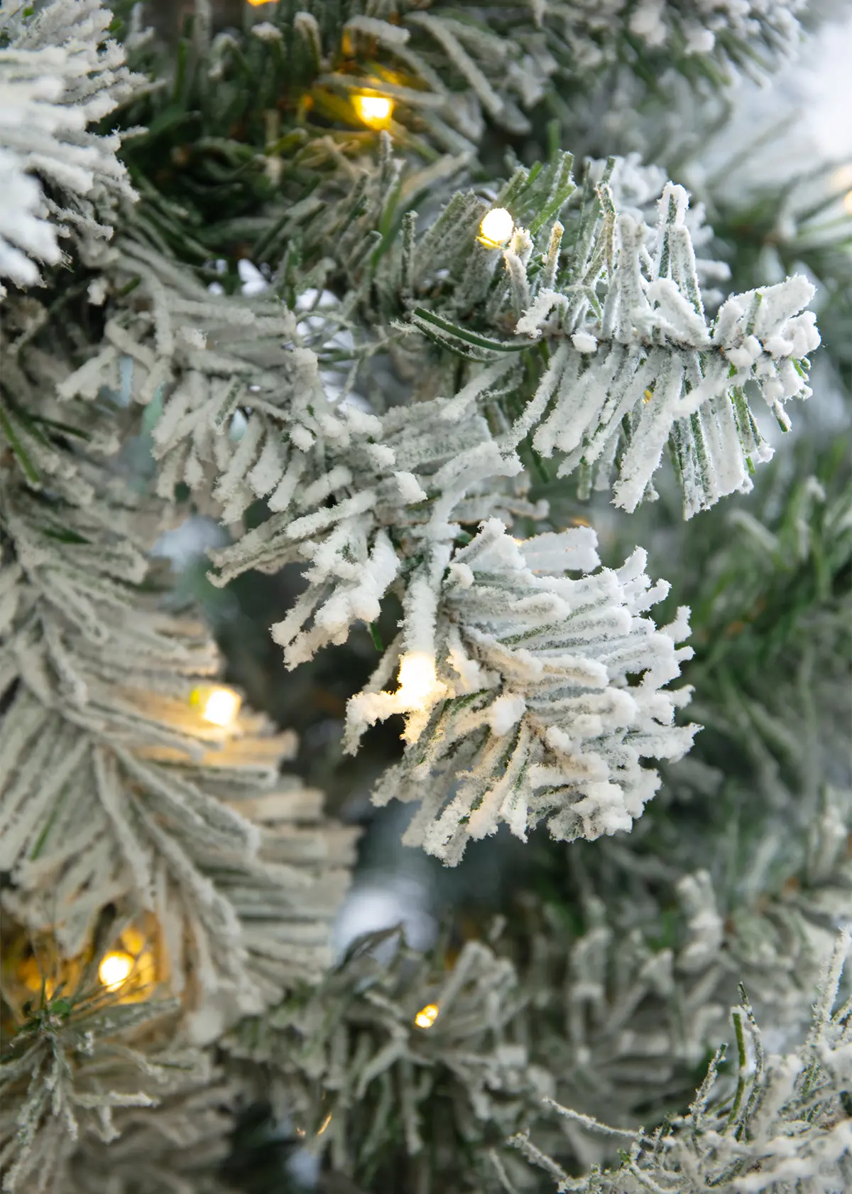 A photo of 7ft Royal Snowy Fir Pre-Lit Artificial Christmas Tree