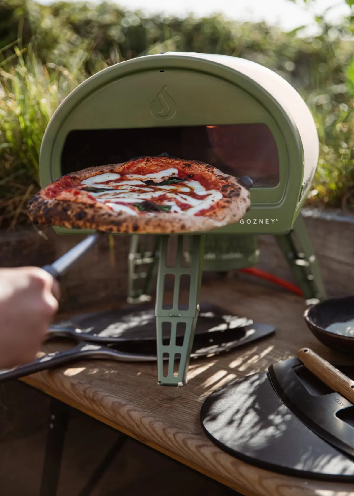 A photo of Gozney Roccbox Monochrome Olive Portable Pizza Oven