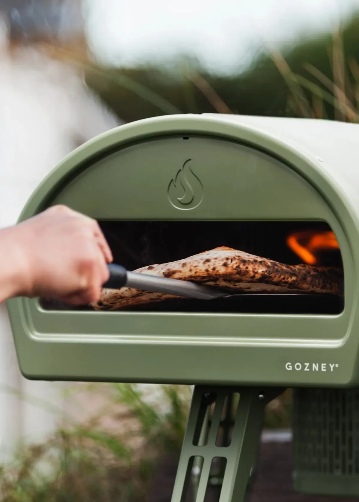 A photo of Gozney Roccbox Monochrome Olive Portable Pizza Oven