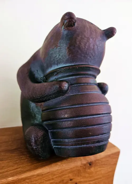 A photo of Winnie-the-Pooh Resin Garden Ornament 15cm Bronze