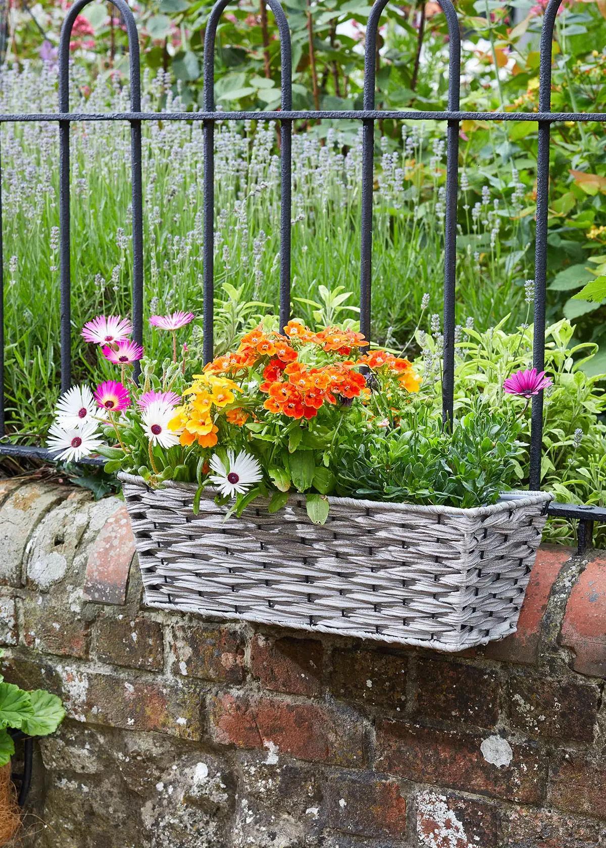 A photo of Soft Grey Bari Faux Rattan 19" Planter
