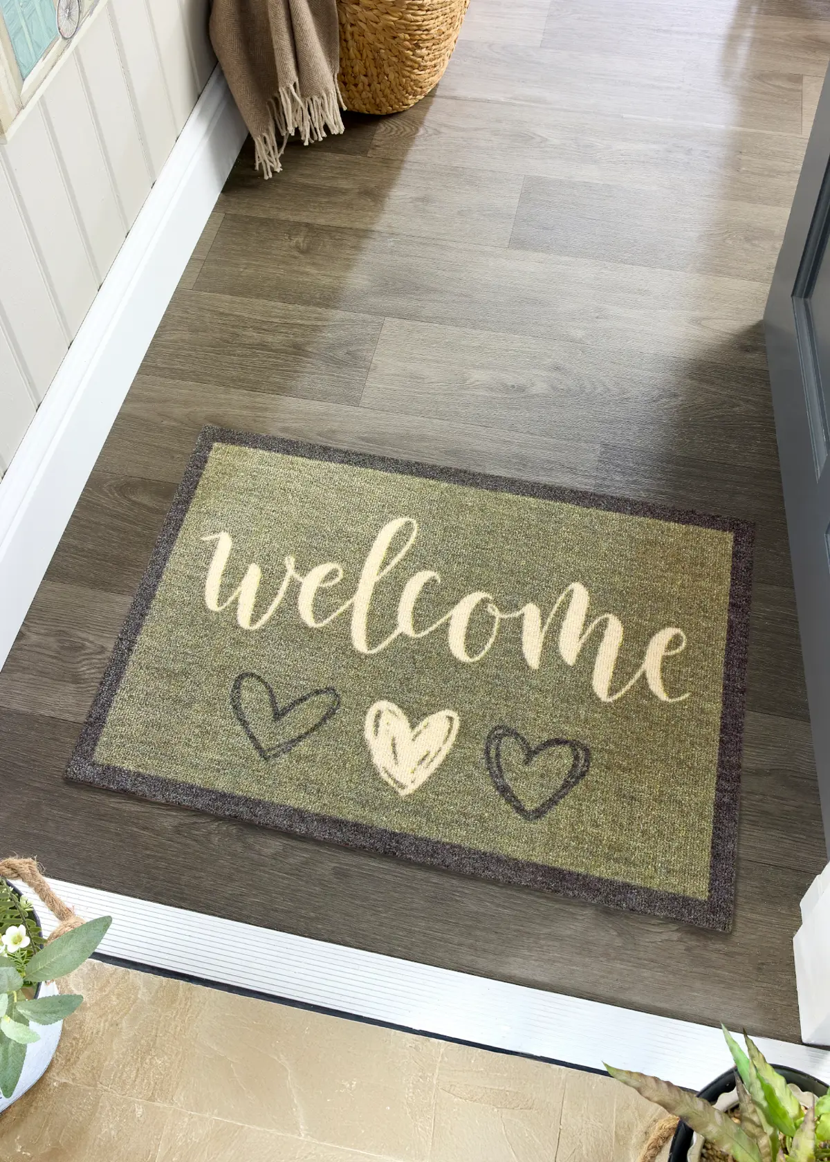 A photo of Dobbies Welcome Hearts Sage Indoor Mat 50x75cm