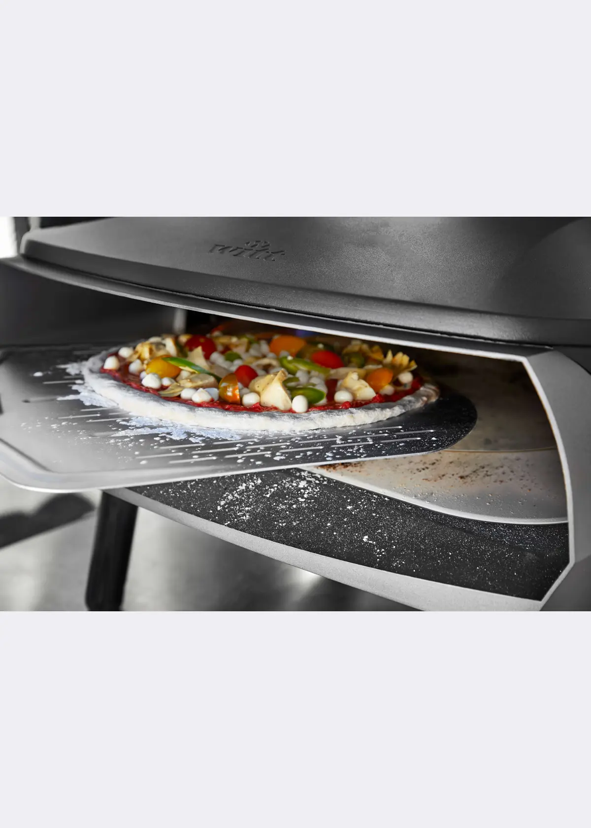 A photo of Witt Perforated 14" Pizza Peel