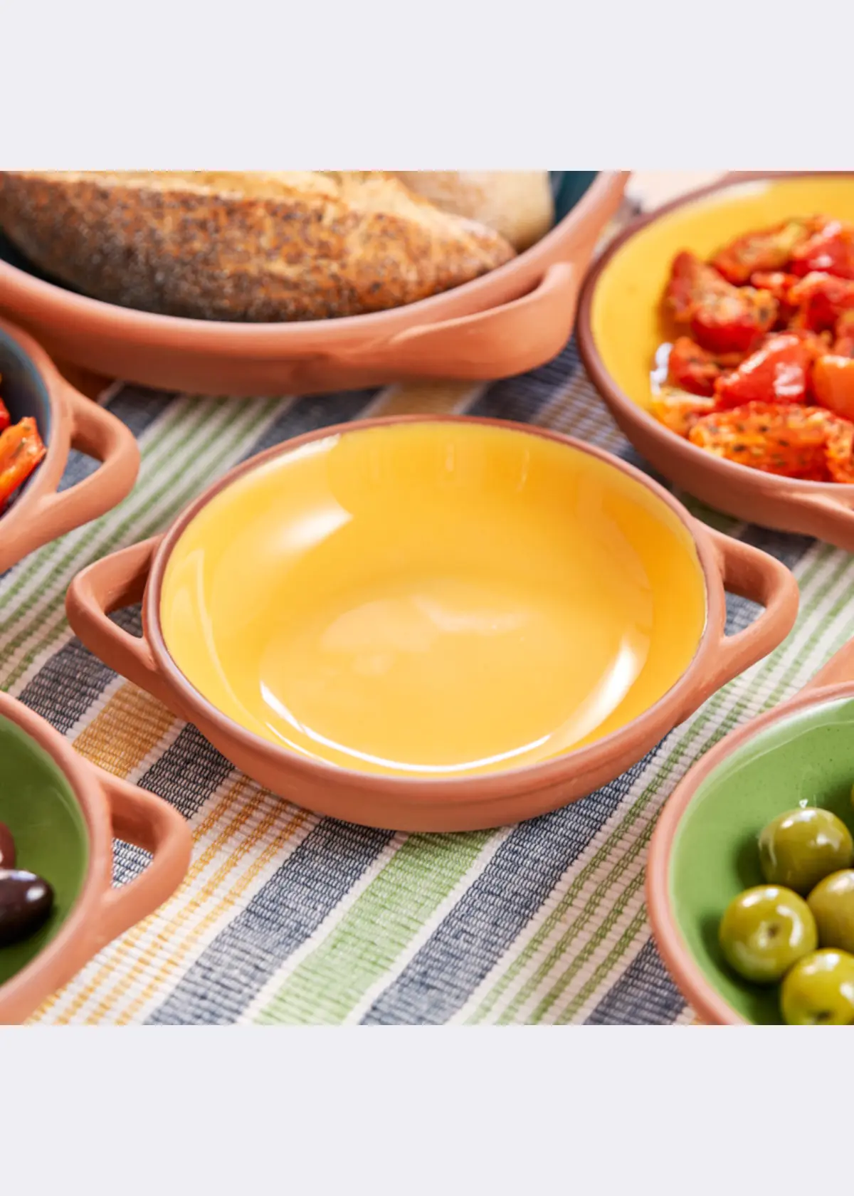 A photo of Sintra Large Glazed Terracotta Tapas Dish Ochre