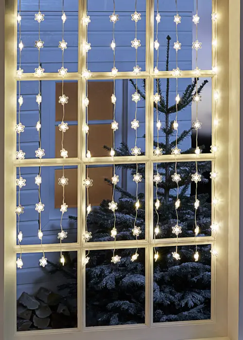 A photo of Warm White Small Snowflake Curtain Lights