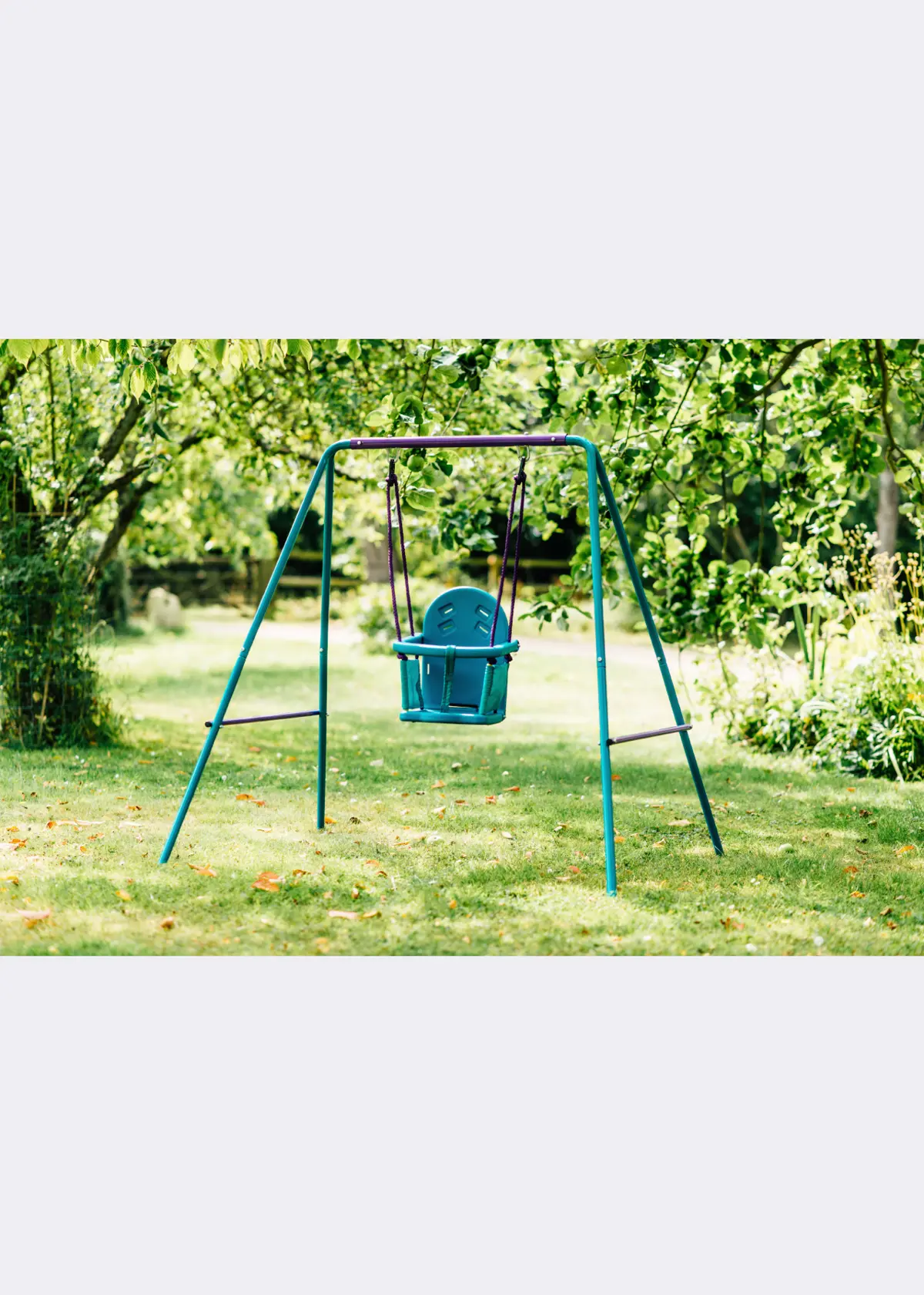 A photo of Plum® 2 in 1 Swing Set Purple & Teal