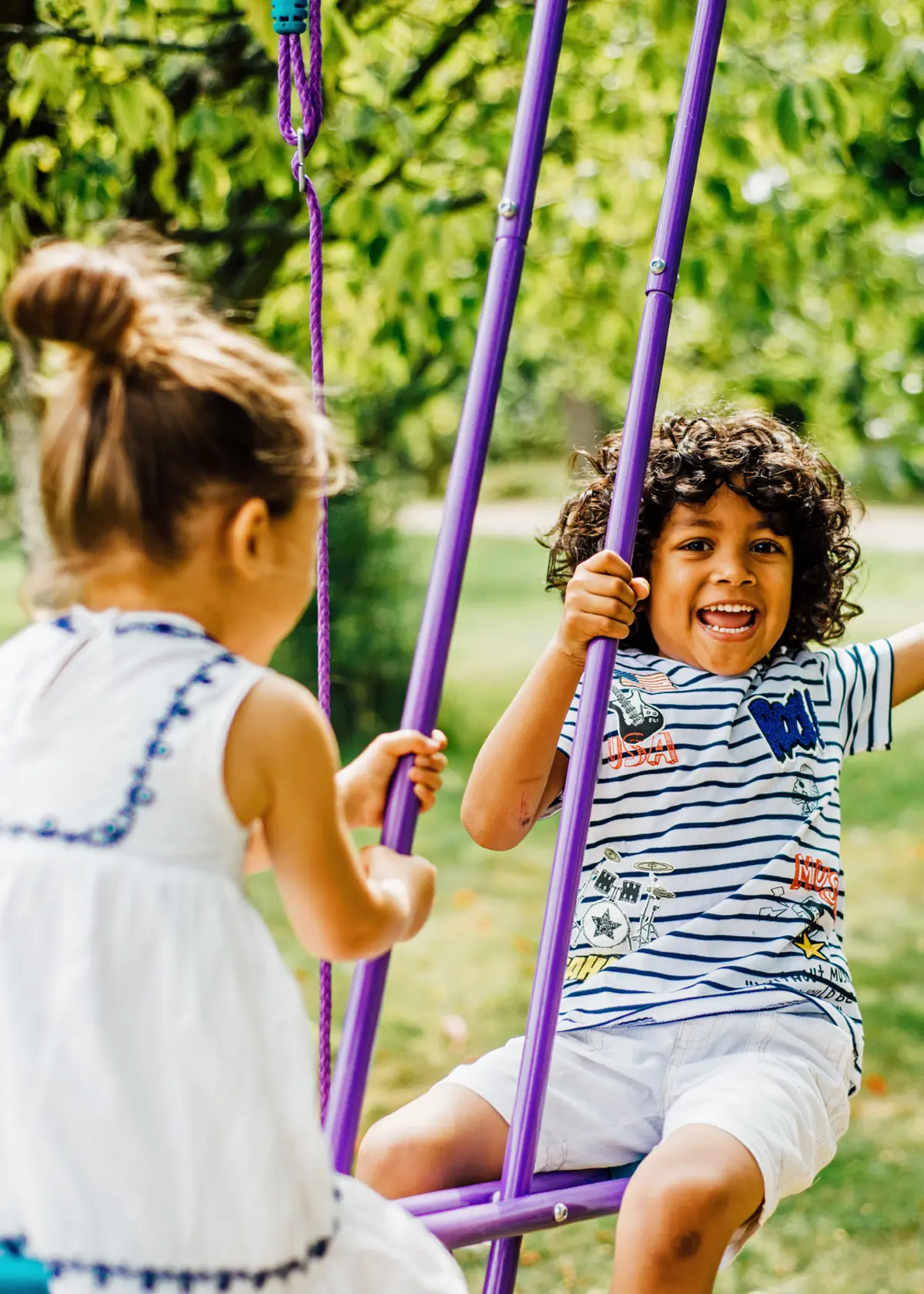 A photo of Plum® Jupiter® Double Swing & Glider Set Purple & Teal