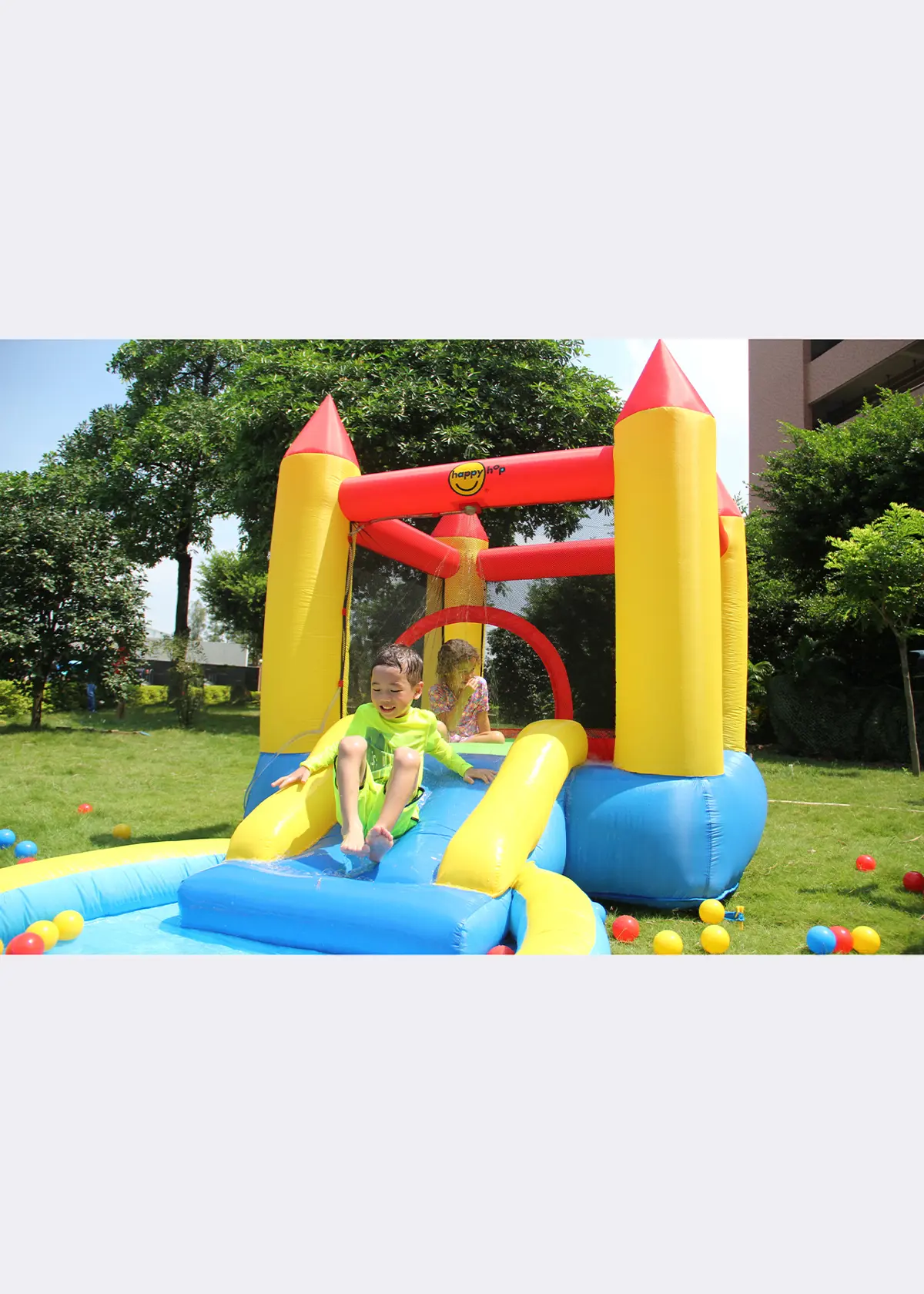A photo of Happy Hop Castle Bouncer with Slide and Hoop