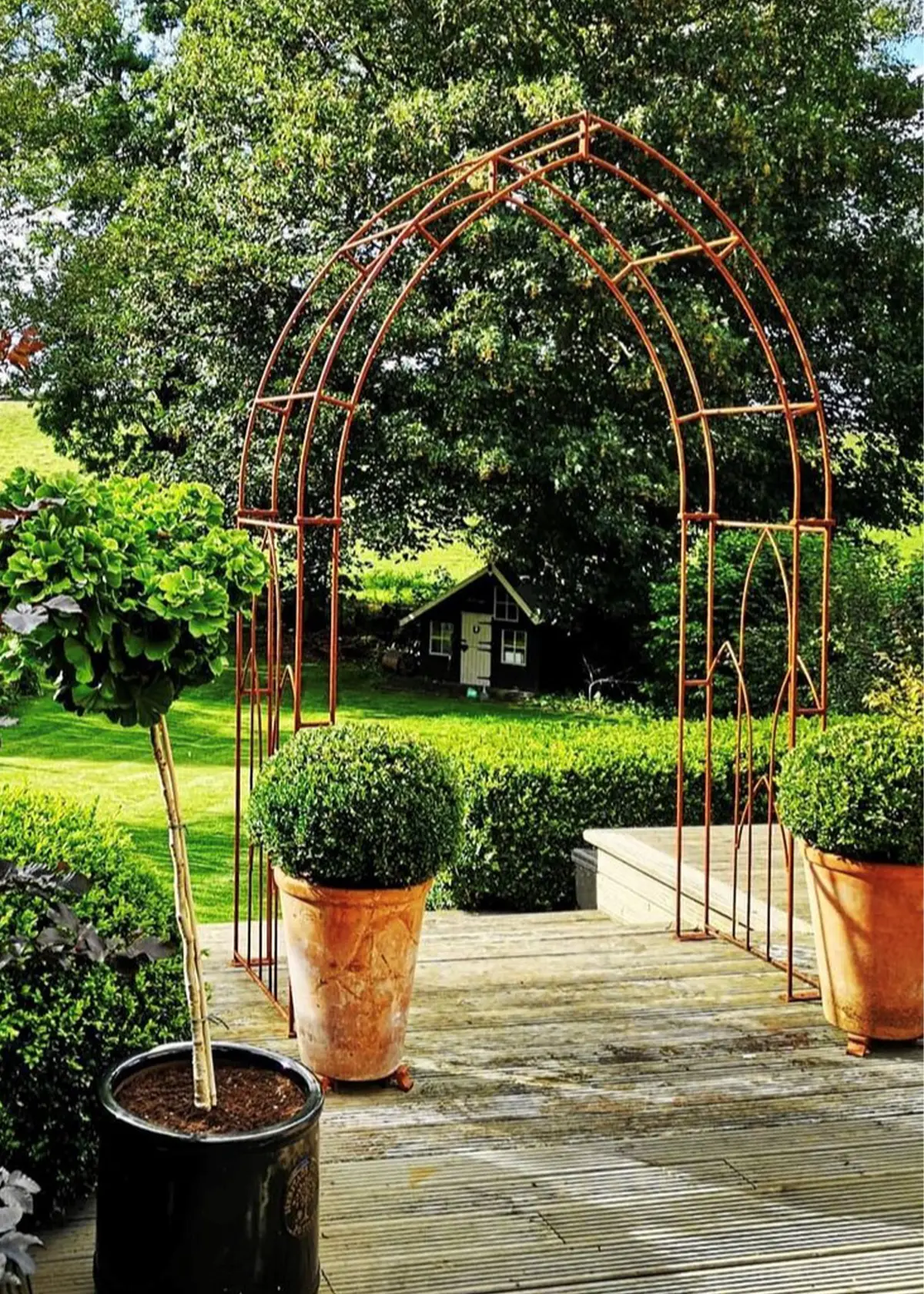 A photo of Gothic Bare Metal Garden Arch with Ground Spikes