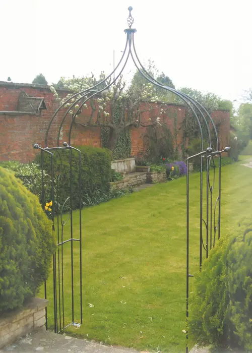 A photo of Flower Ogee Garden Arch with Ground Spikes