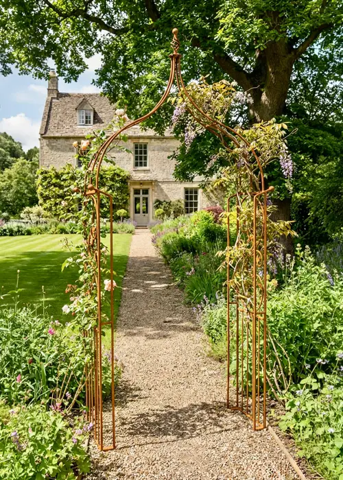 A photo of Imperial Traditional Bare Metal Garden Arch With Ground Spik