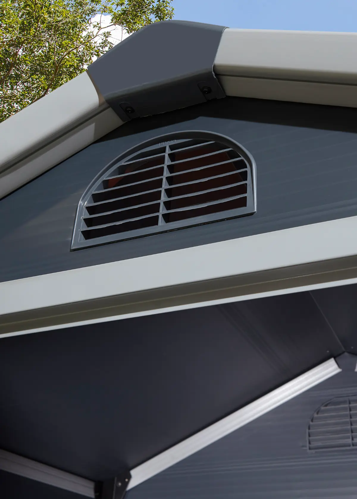 A photo of Airevale 4x3 Plastic Apex Shed in Dark Grey