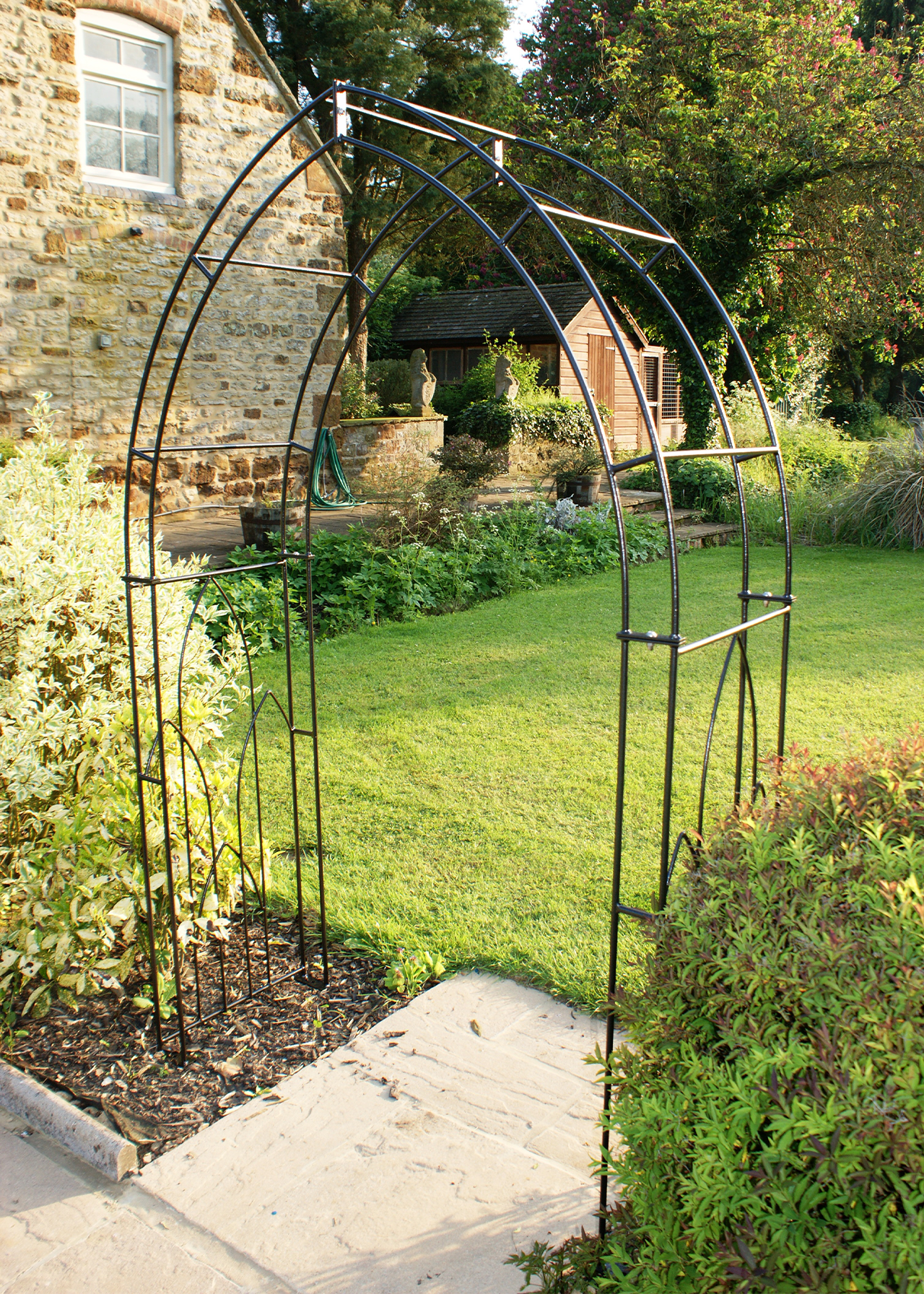 Gothic garden arch with ground spikes