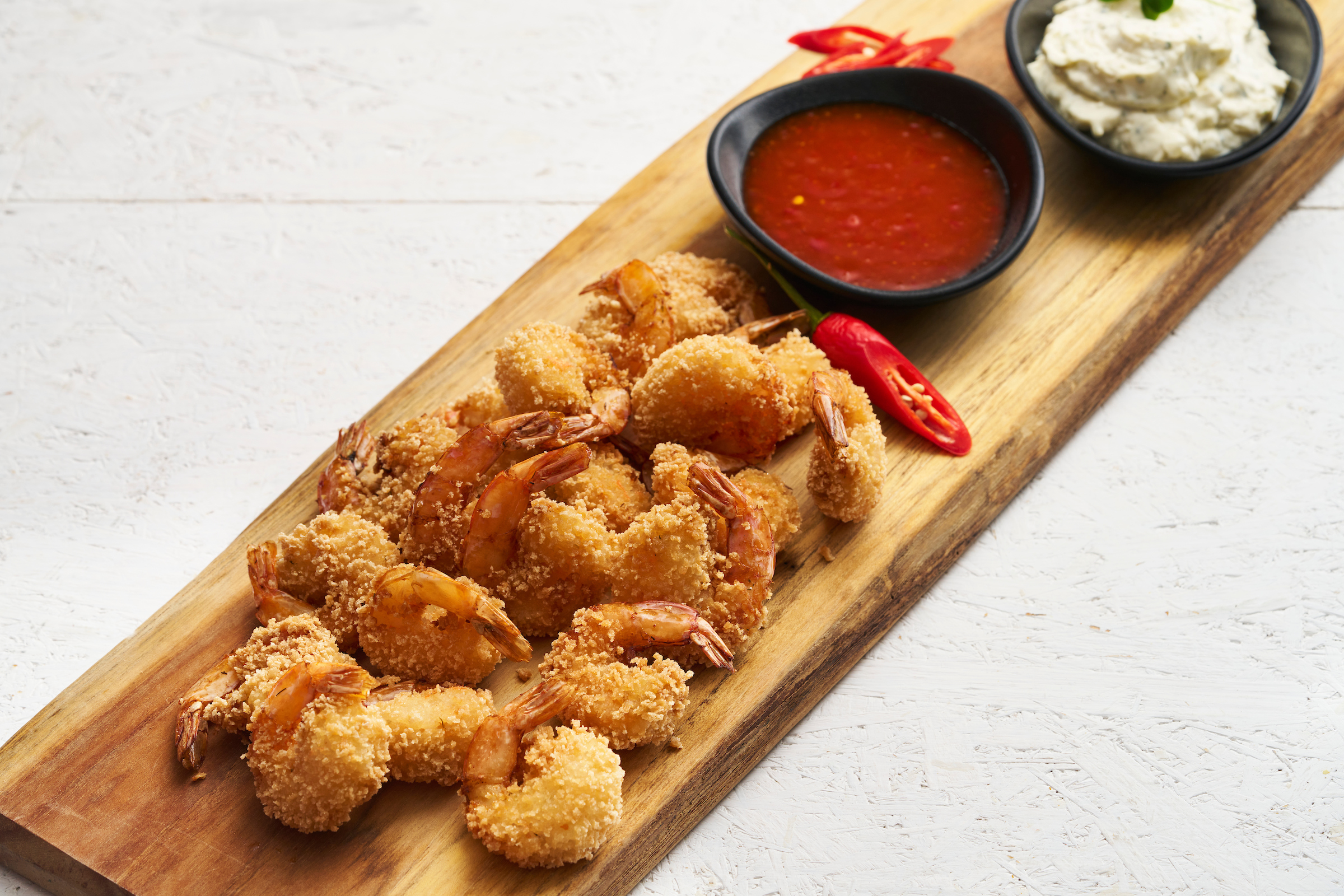 Gepaneerde scampi met piri piri