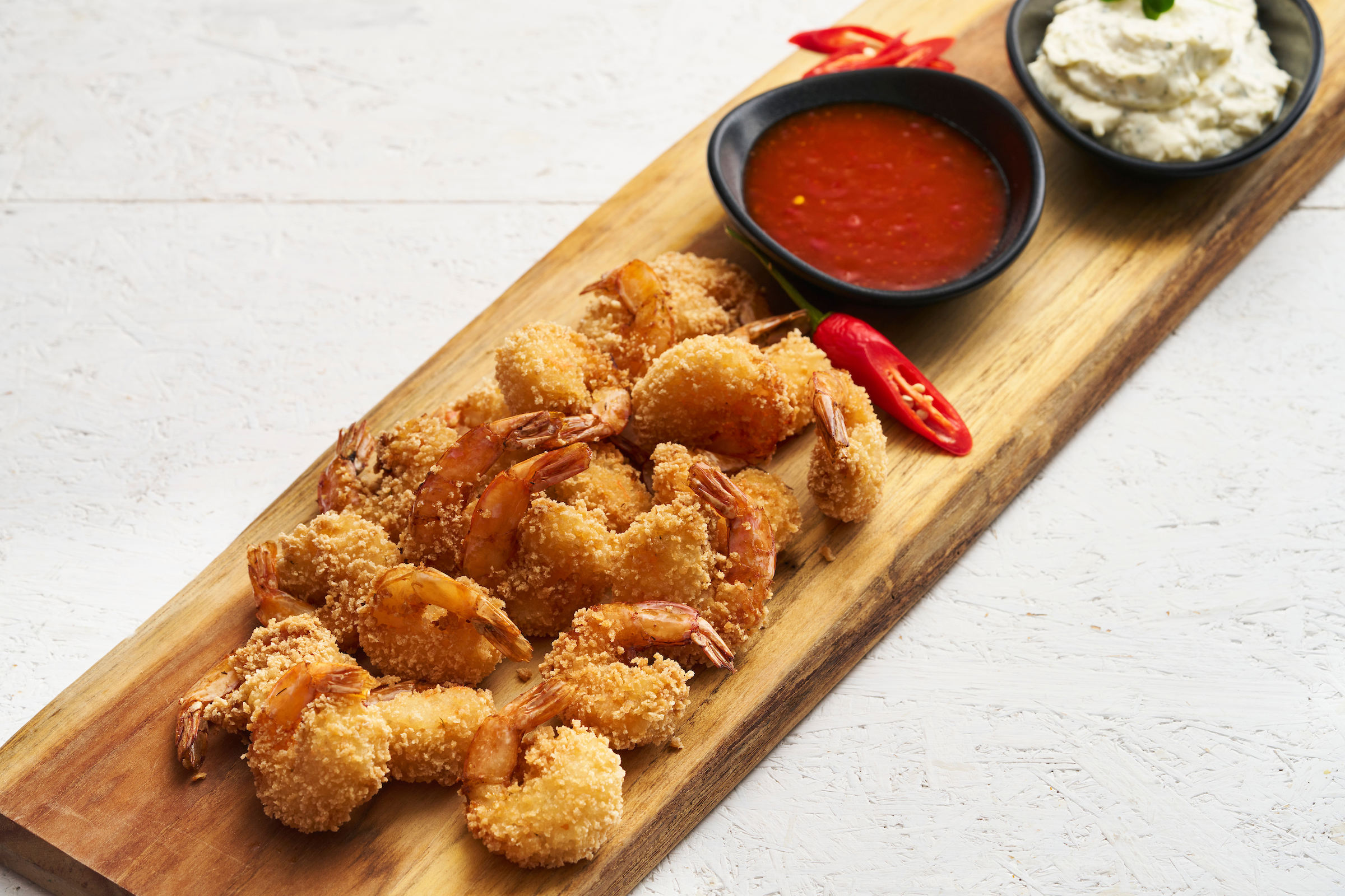 Gepaneerde scampi met piri piri