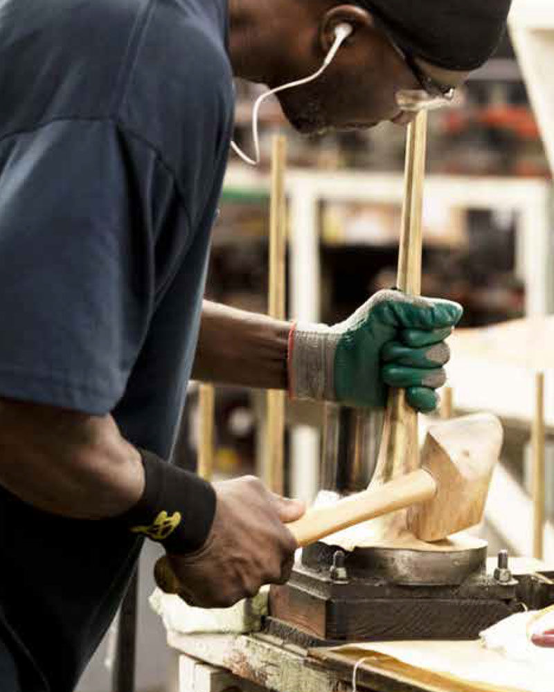 Man Working on Trumpet Bell