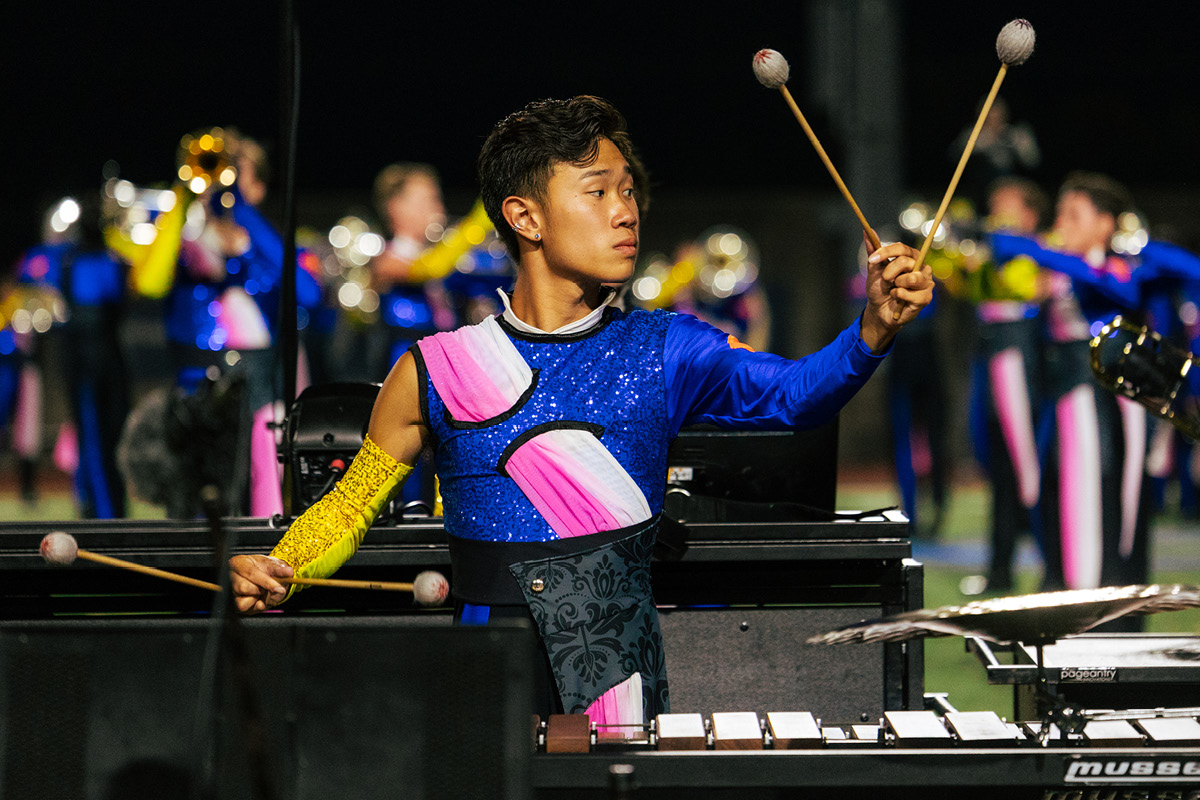 Marching band member playing the xylophone